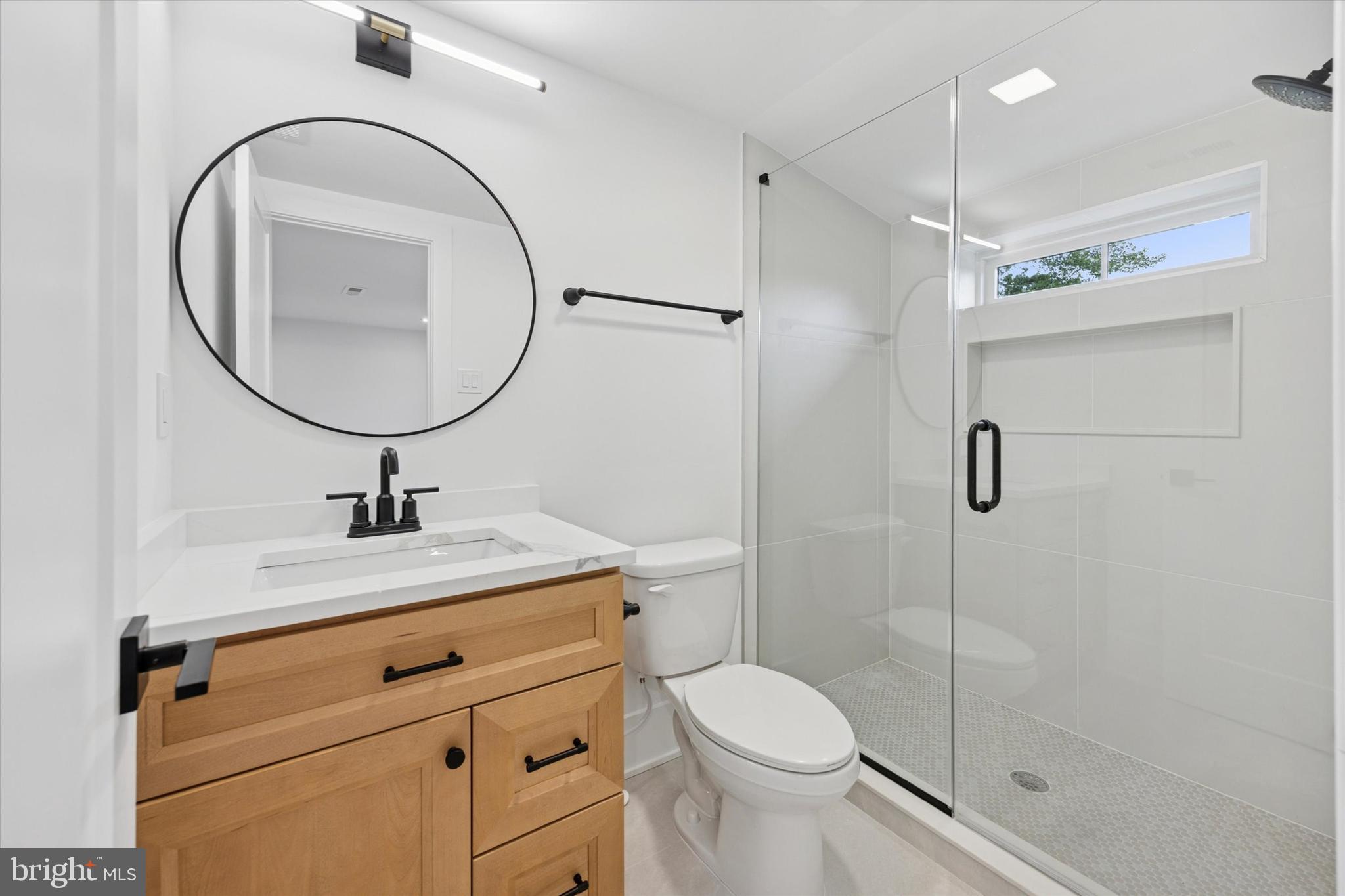 631 Pardee Lane Haddonfield, NJ 08033 - Photo 29 of 37 a bathroom with a granite countertop sink a toilet and a mirror