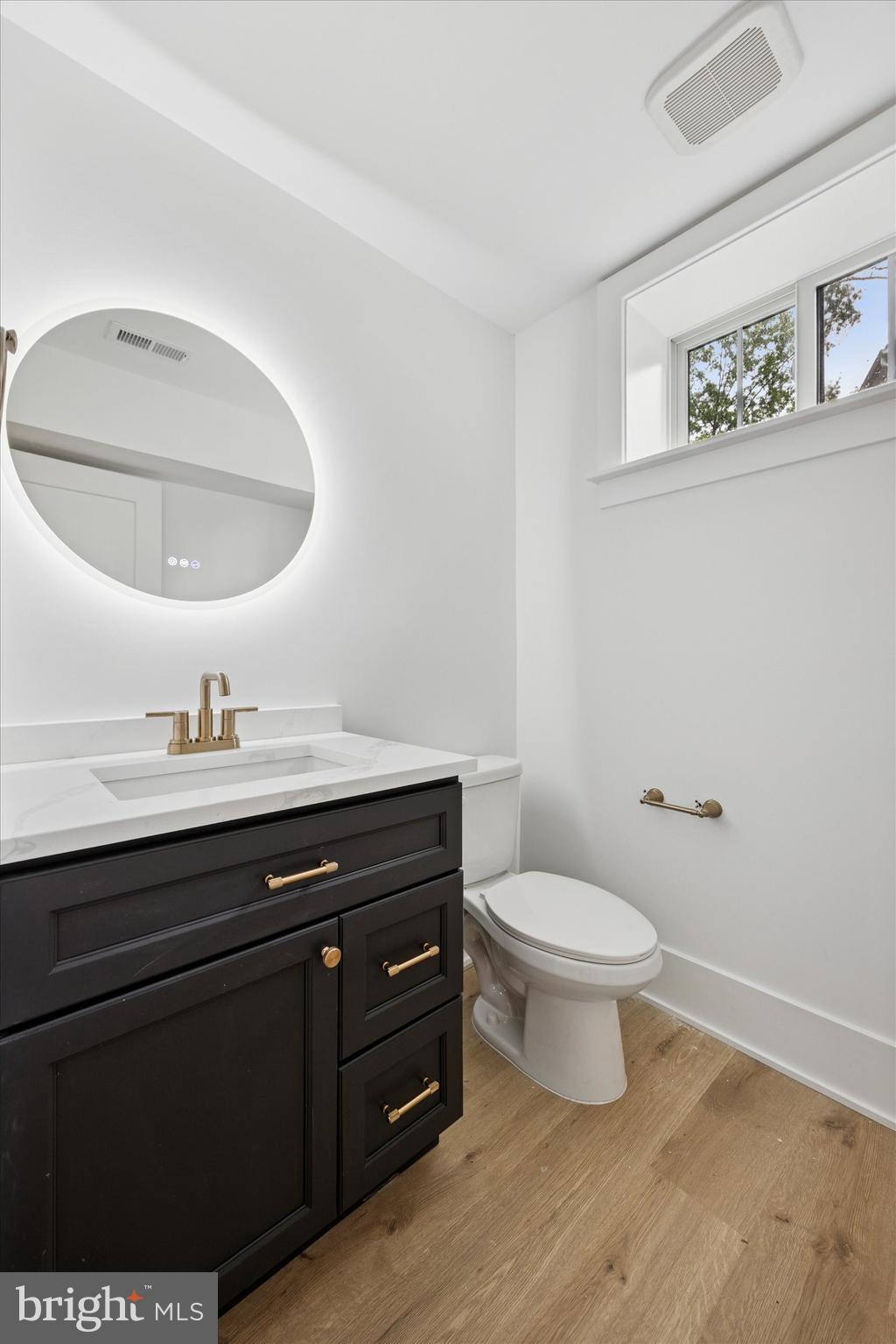 631 Pardee Lane Haddonfield, NJ 08033 - Photo 31 of 37 a bathroom with a toilet a sink and mirror