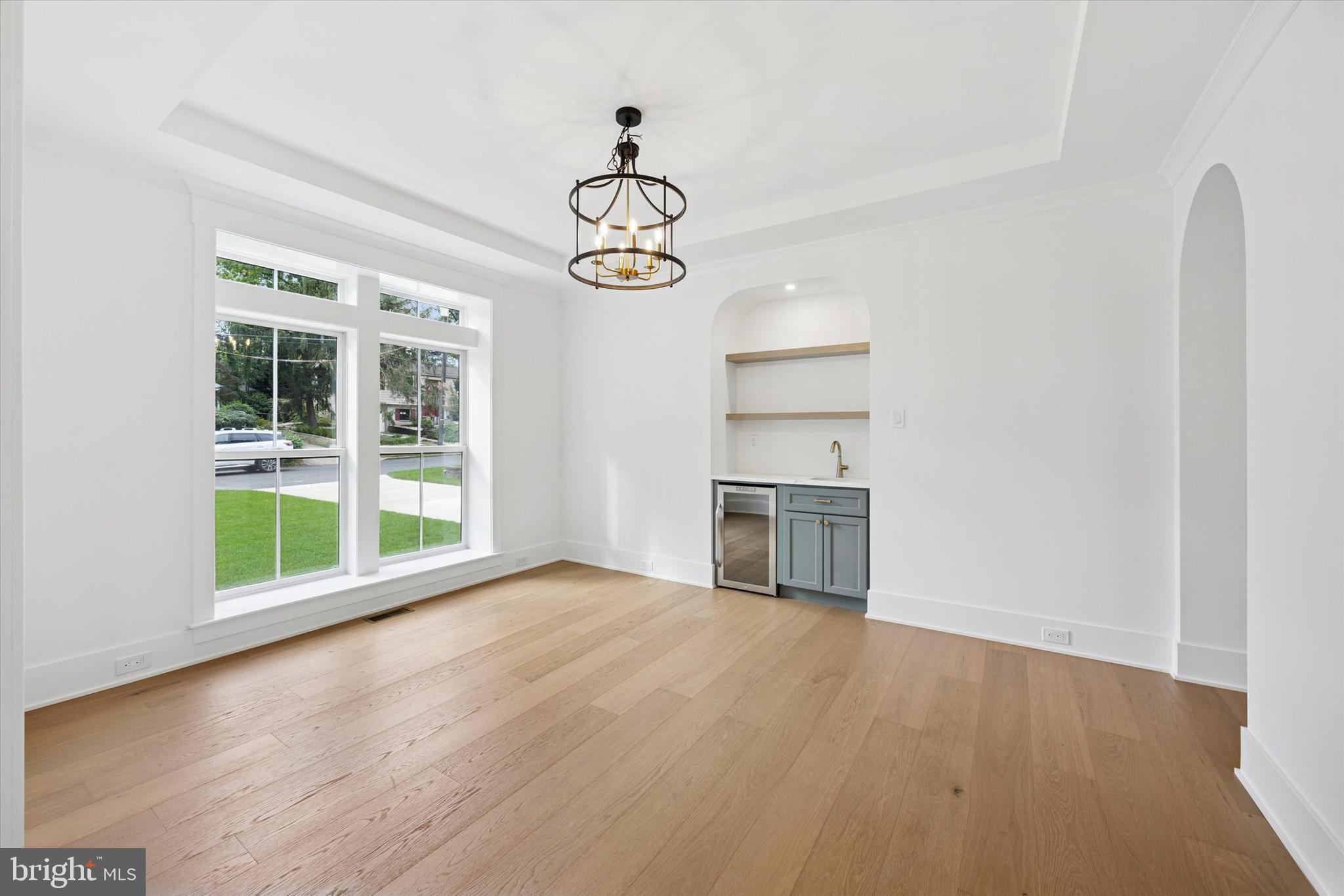 631 Pardee Lane Haddonfield, NJ 08033 - Photo 5 of 37 a view of empty room with wooden floor and windows
