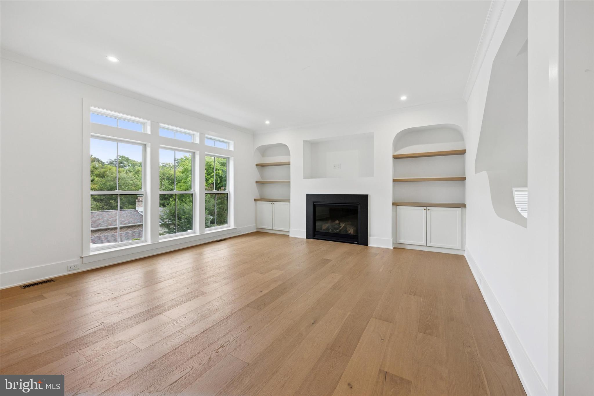 631 Pardee Lane Haddonfield, NJ 08033 - Photo 9 of 37 a view of empty room with wooden floor and fireplace