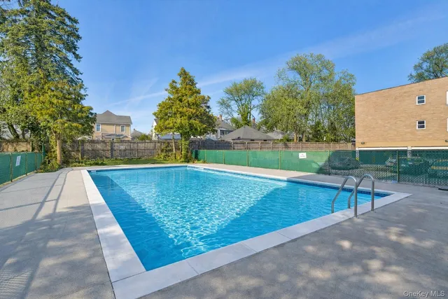a view of a swimming pool with a patio