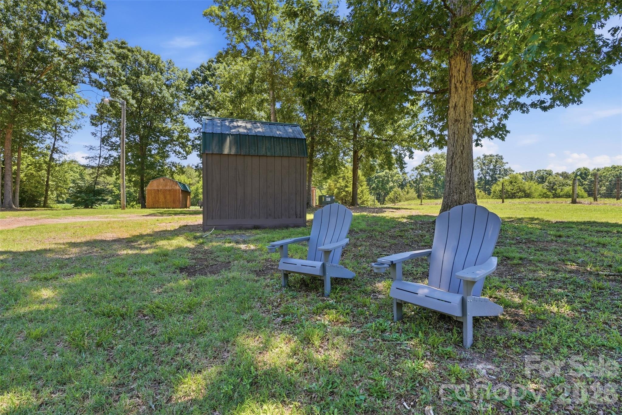 4406 Lucy Short Cut Road Marshville, NC 28103 - Photo 30 of 30 a view of a chair and table in the garden