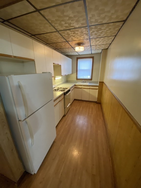 33-35 Malvey Street Fall River, MA 02720 - Photo 13 of 18 a storage room with wooden floor and furniture