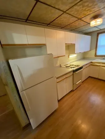 a kitchen with a stove and a refrigerator