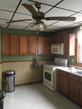 a kitchen with a stove and a microwave