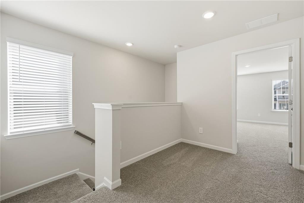 1503 Wild Fox Run Lawrenceville, GA 30045 - Photo 17 of 46 an empty room with windows