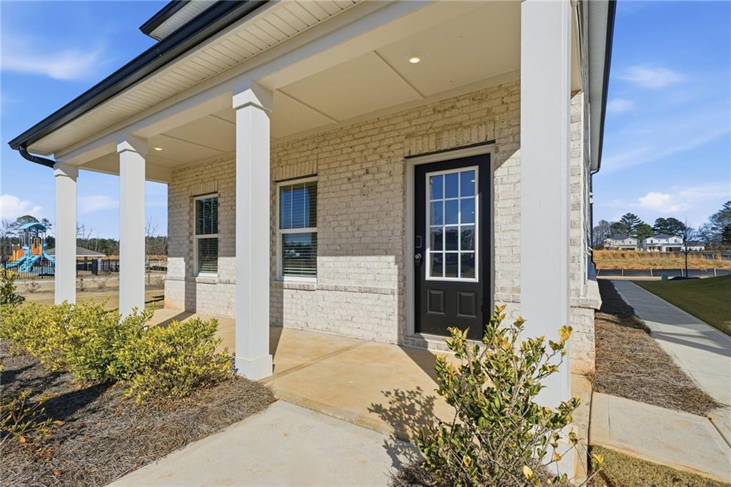 1503 Wild Fox Run Lawrenceville, GA 30045 - Photo 2 of 46 a front view of a house with a porch