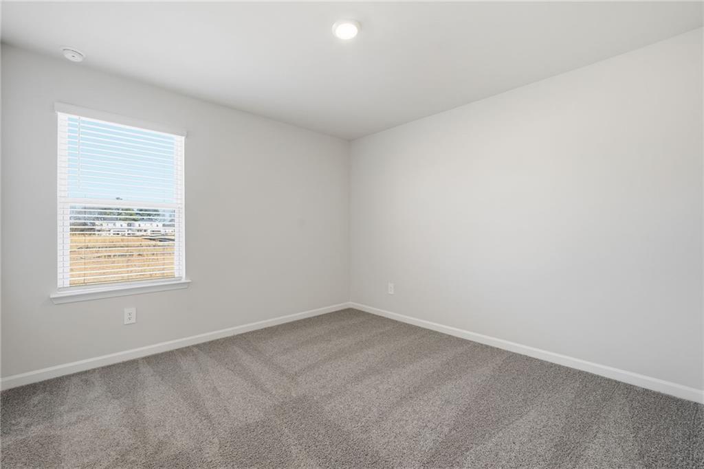 1503 Wild Fox Run Lawrenceville, GA 30045 - Photo 27 of 46 an empty room with a window