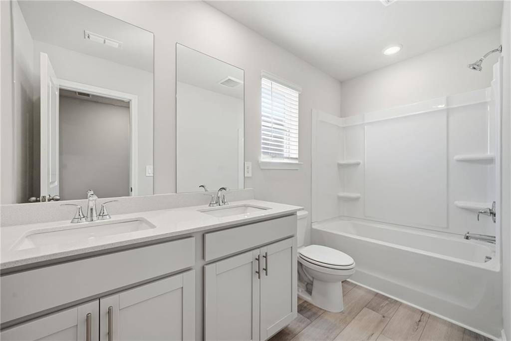 1503 Wild Fox Run Lawrenceville, GA 30045 - Photo 30 of 46 a bathroom with a sink a toilet and shower