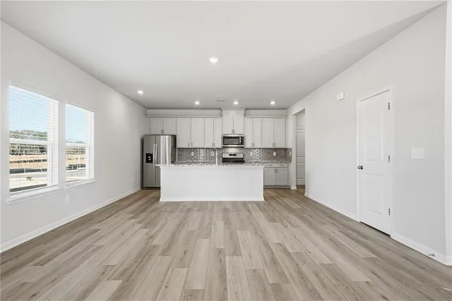 a view of kitchen with wooden floor