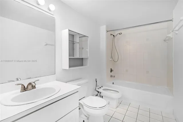 a bathroom with a sink toilet and mirror