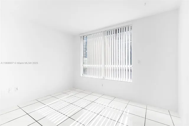 a bathroom with a glass door shower and a sink