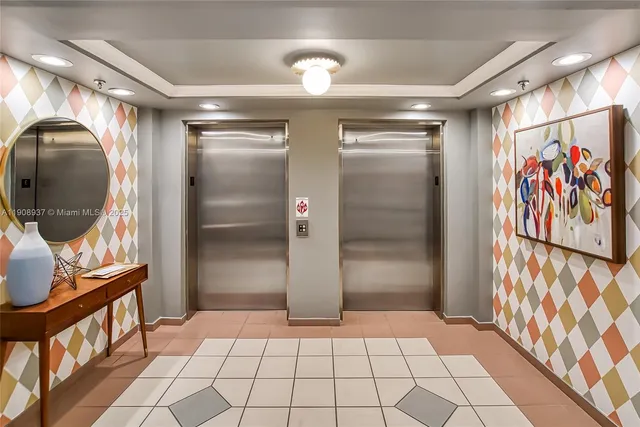 a view of a tall building next to a yard