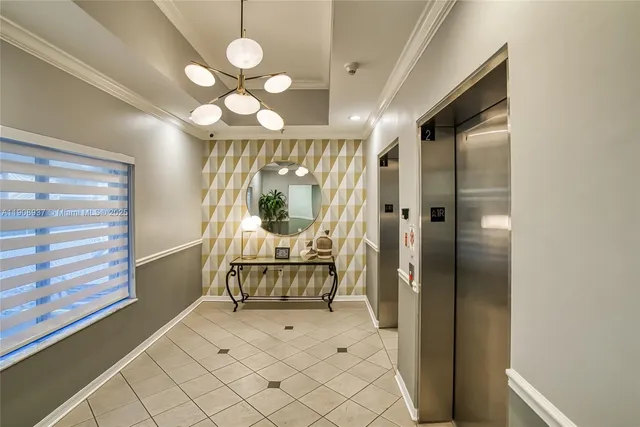 a front view of a building with a garden