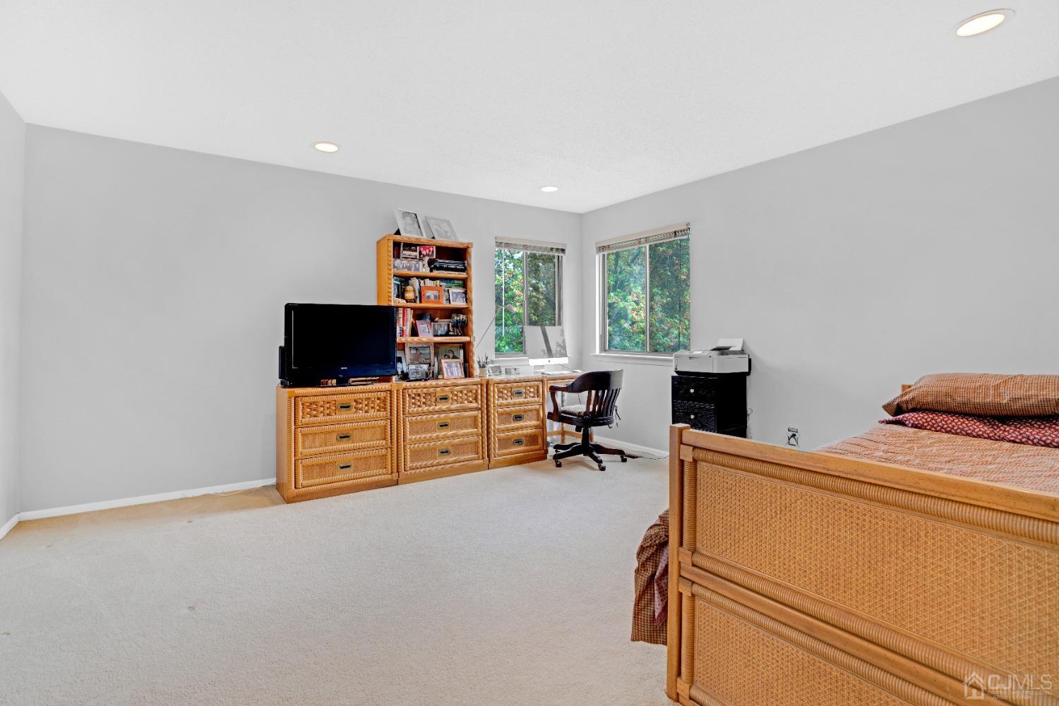 58 Gate House Lane Edison, NJ 08820 - Photo 18 of 37 a room with furniture and a flat screen tv