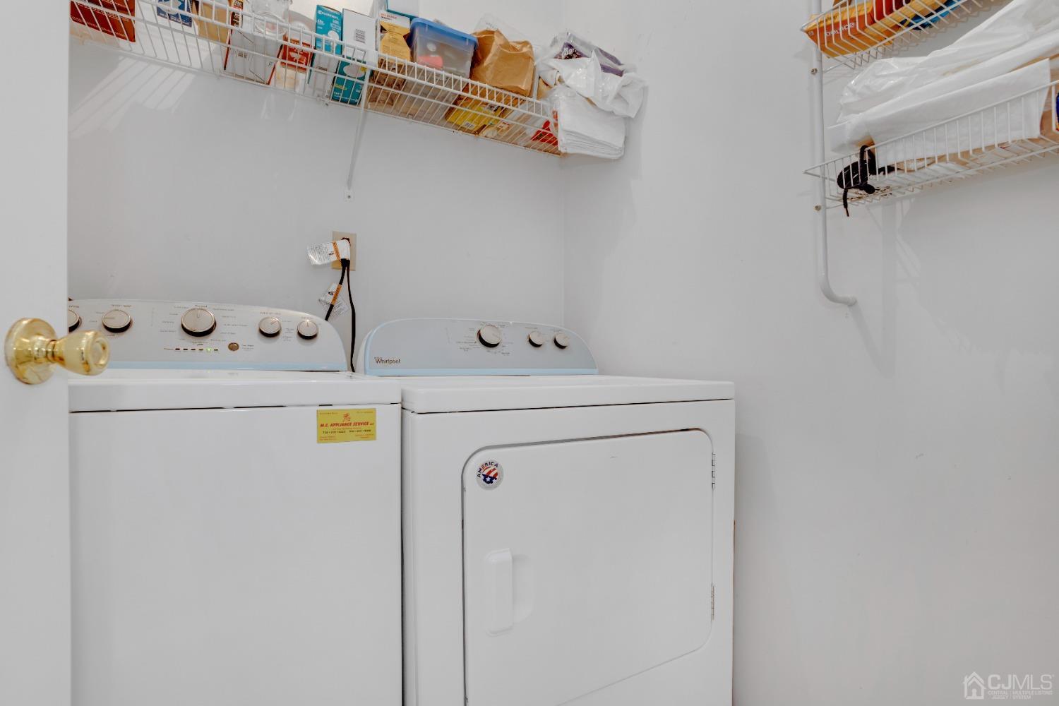 58 Gate House Lane Edison, NJ 08820 - Photo 21 of 37 a utility room with dryer and washer