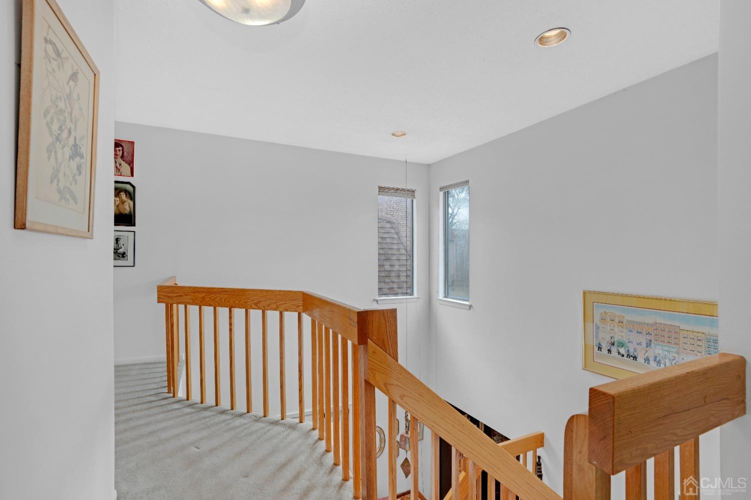58 Gate House Lane Edison, NJ 08820 - Photo 22 of 37 a view of a hallway with windows