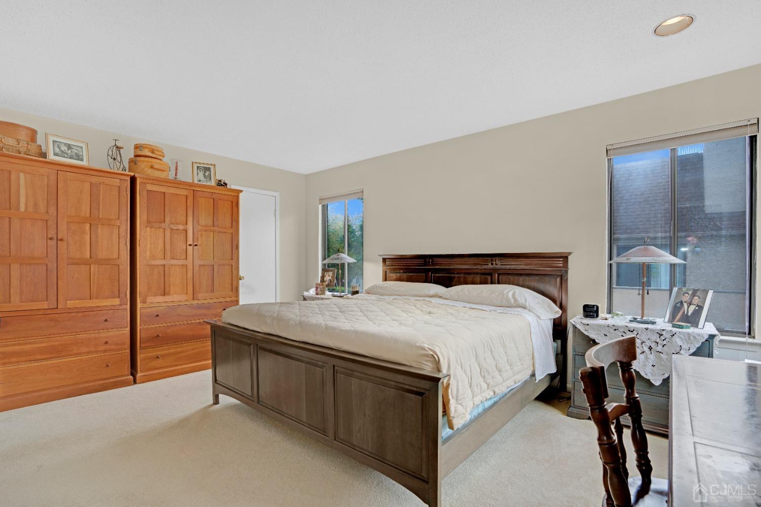 58 Gate House Lane Edison, NJ 08820 - Photo 23 of 37 a bedroom with a bed and a dresser