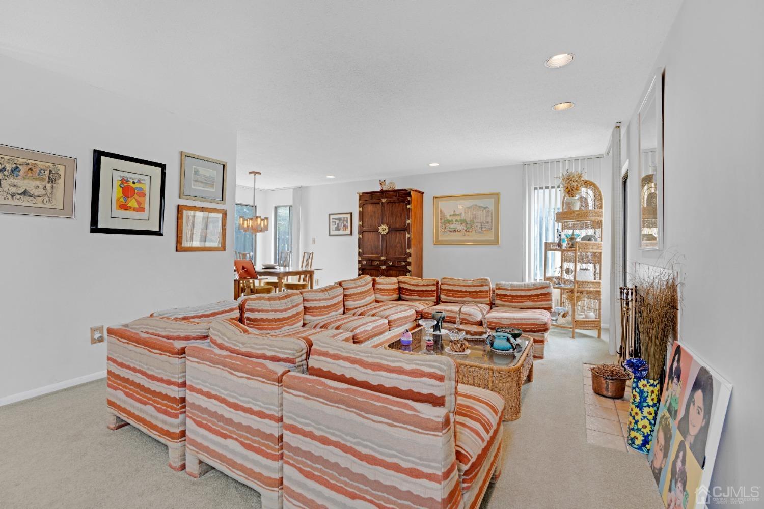 58 Gate House Lane Edison, NJ 08820 - Photo 7 of 37 a bedroom with furniture and a flat screen tv