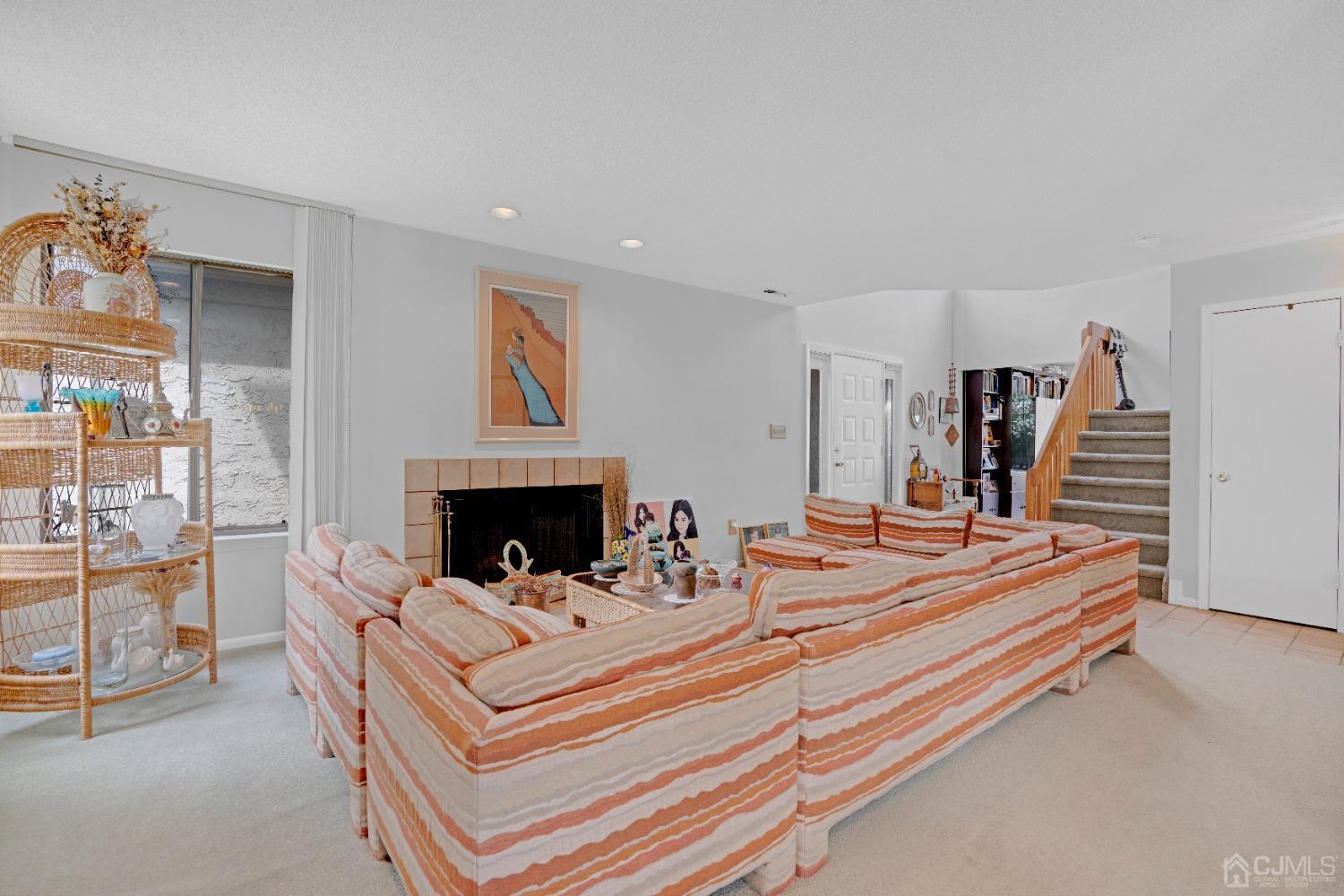 58 Gate House Lane Edison, NJ 08820 - Photo 8 of 37 a view of living room with furniture and fireplace