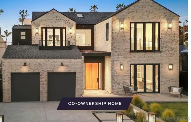 a front view of a house with large windows