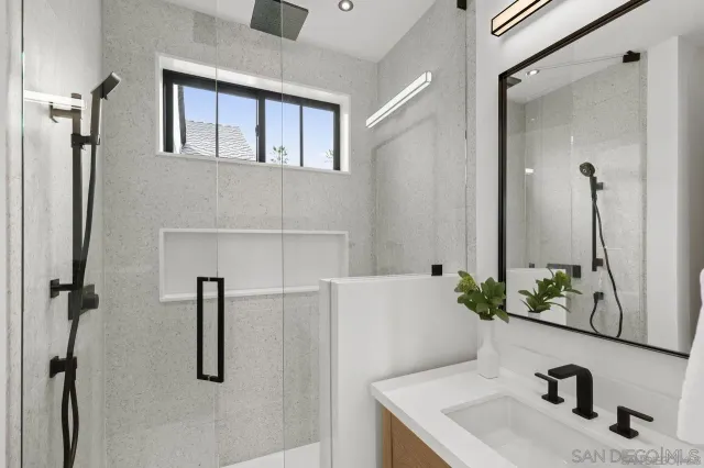a bathroom with a sink and mirror