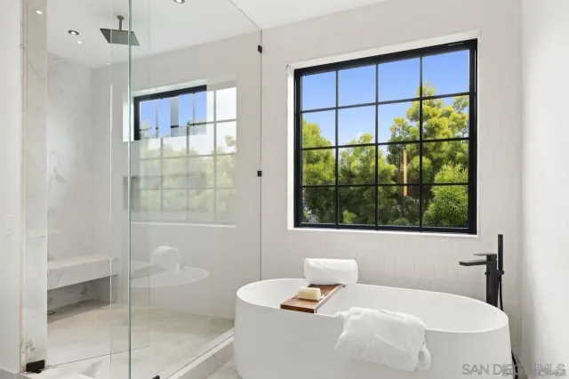 a bathroom with a toilet sink and shower