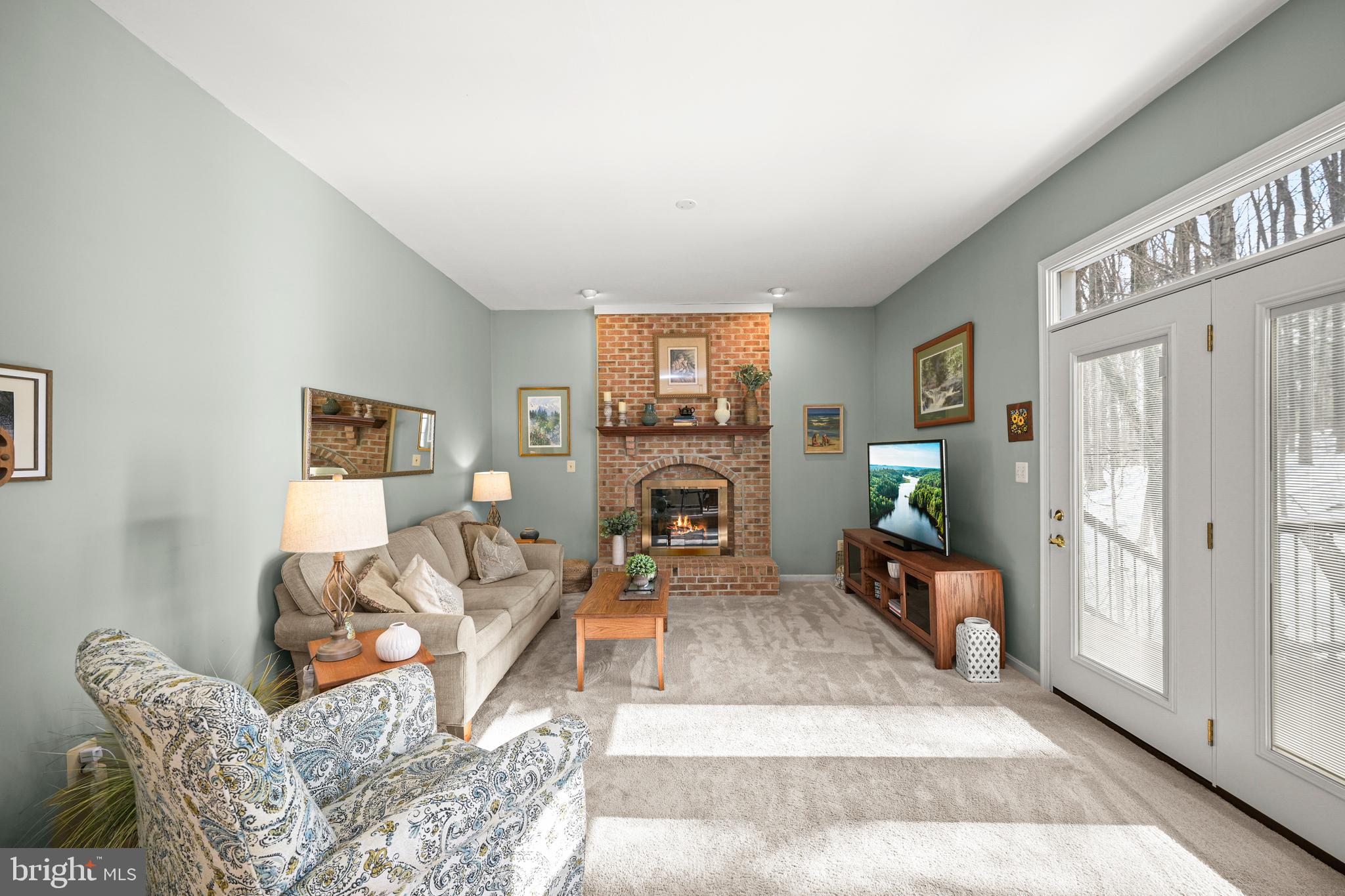 9733 Starling Road Ellicott City, MD 21042 - Photo 12 of 55 Family room with fireplace & access to deck