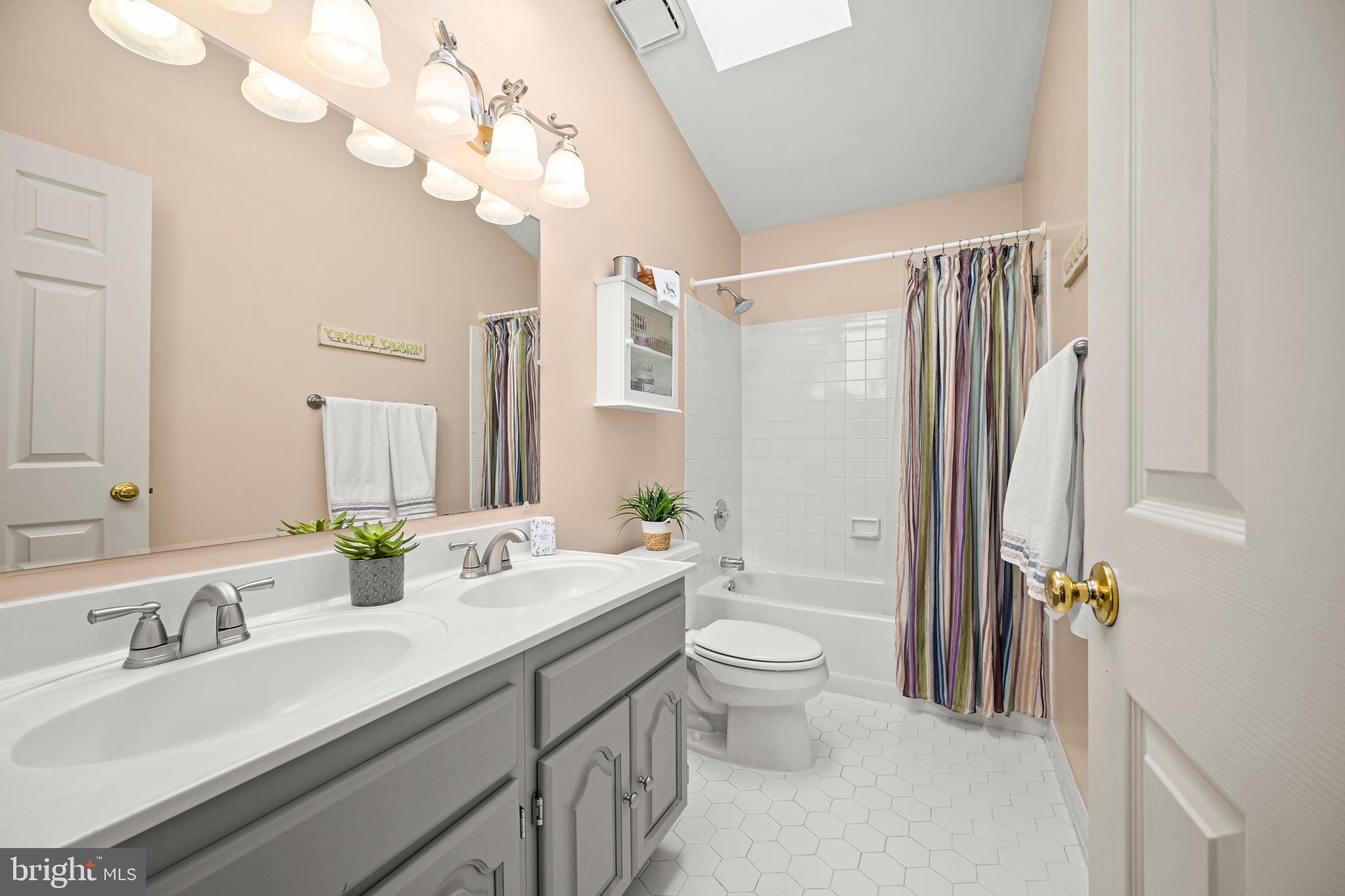 9733 Starling Road Ellicott City, MD 21042 - Photo 36 of 55 Hall bath with double sinks & skylight