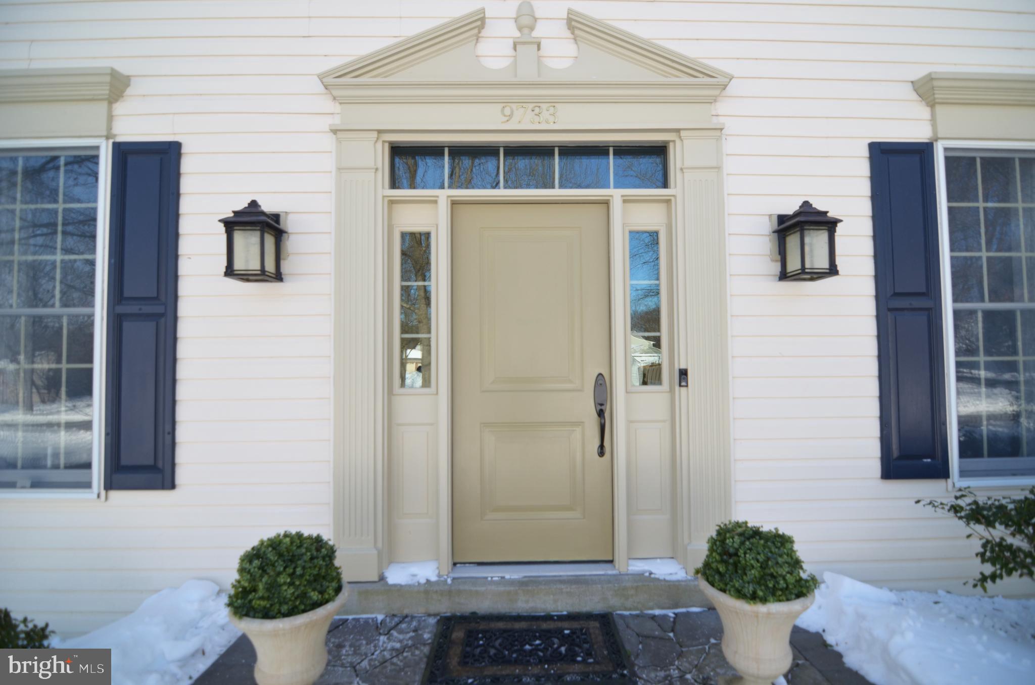 9733 Starling Road Ellicott City, MD 21042 - Photo 6 of 6 a view of a front door and a potted plant