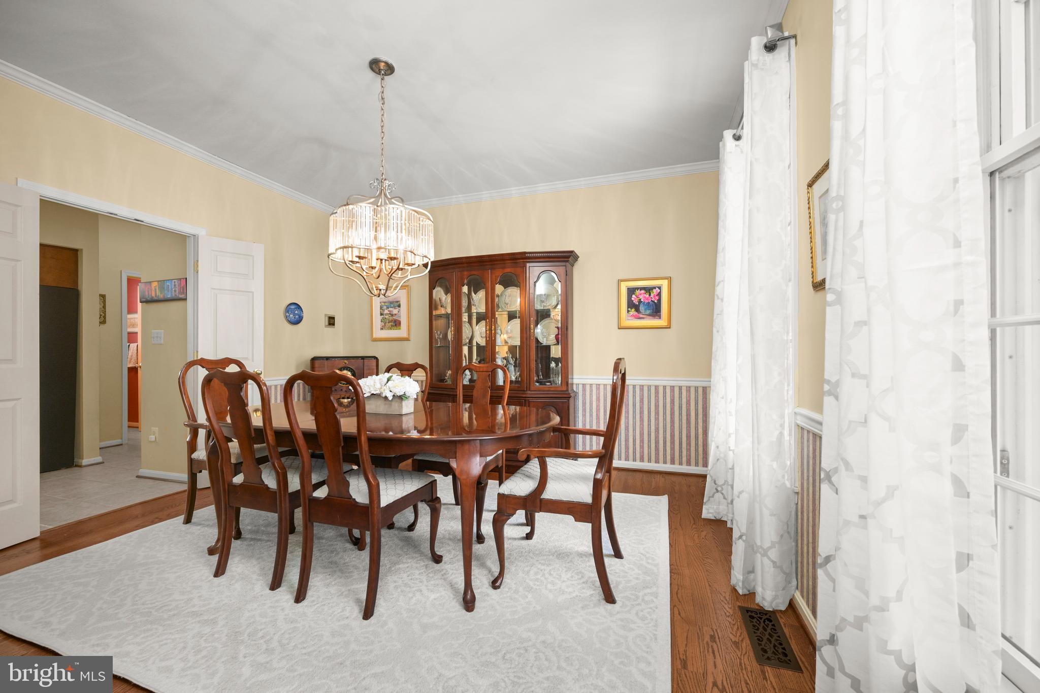 9733 Starling Road Ellicott City, MD 21042 - Photo 10 of 55 Formal dining room with hardwood floors