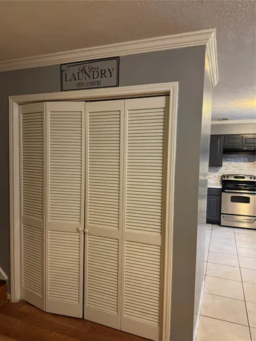 a view of a refrigerator and a stove