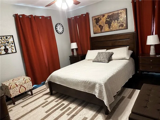 a bedroom with bed and a closet