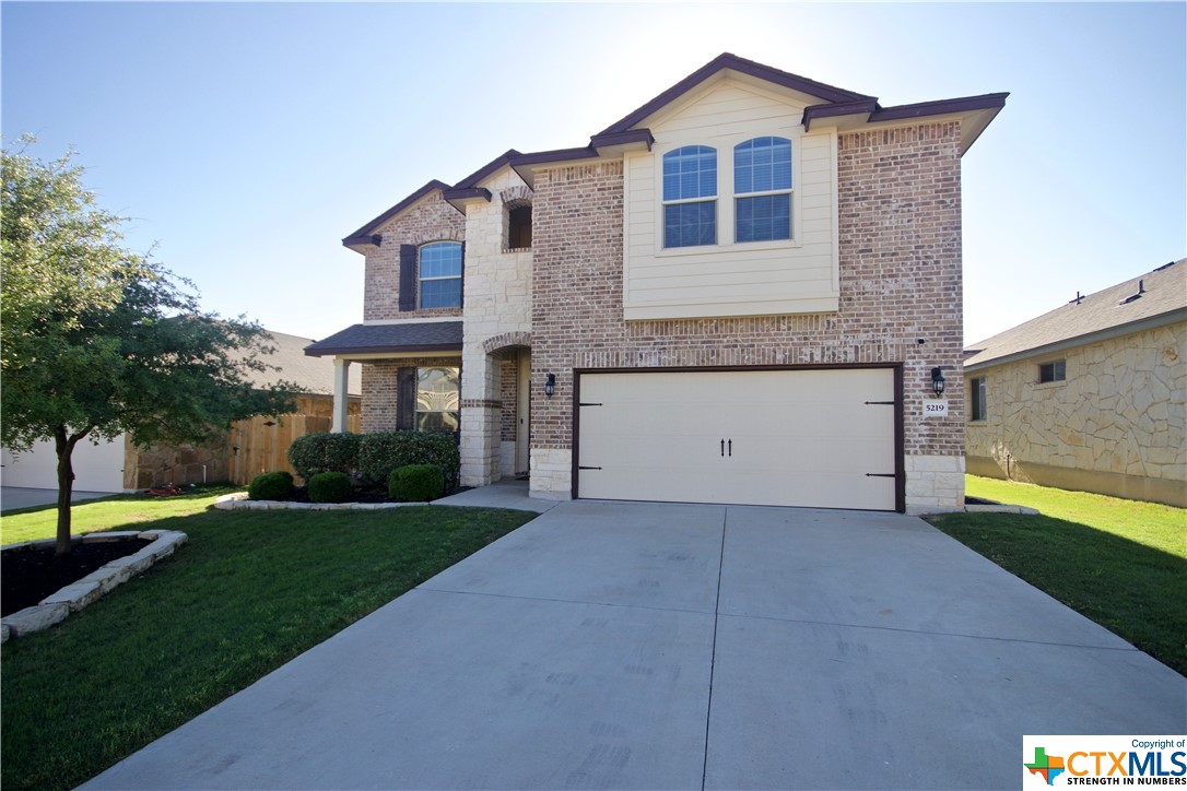 5219 Dauphin Drive Belton, TX 76513 - Photo 1 of 1 a front view of a house with a yard and garage