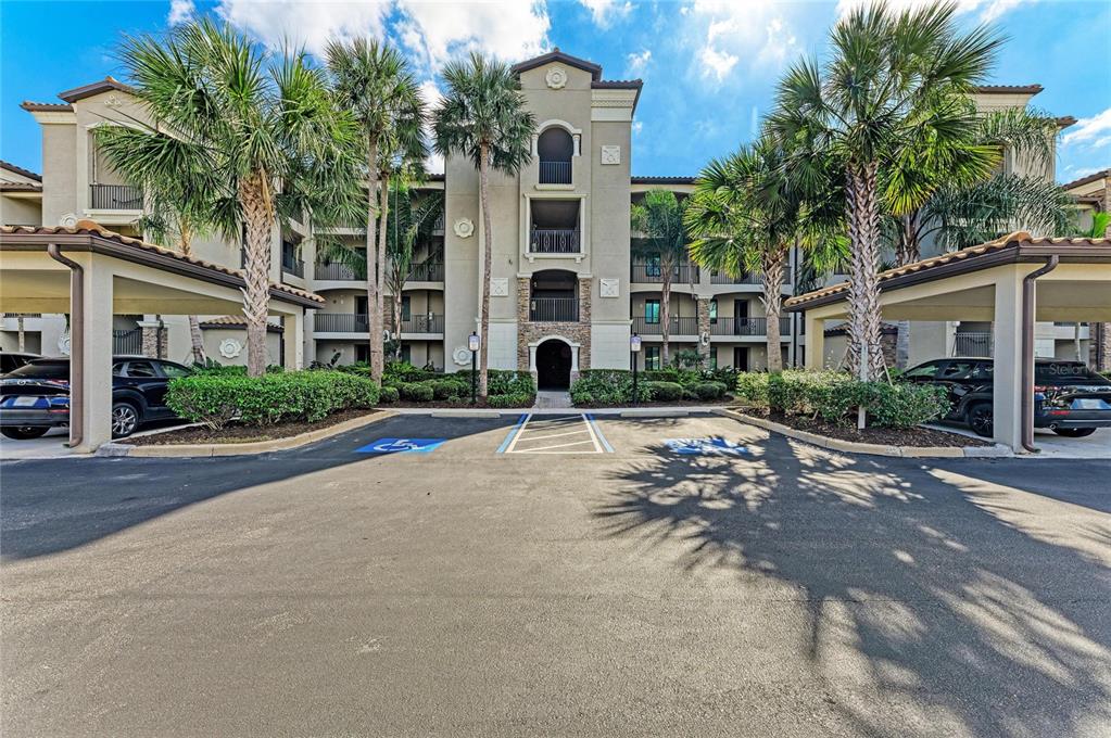 17006 Vardon Terrace, Unit 206 Lakewood Ranch, FL 34211 - Photo 1 of 79 front view of a building with a yard