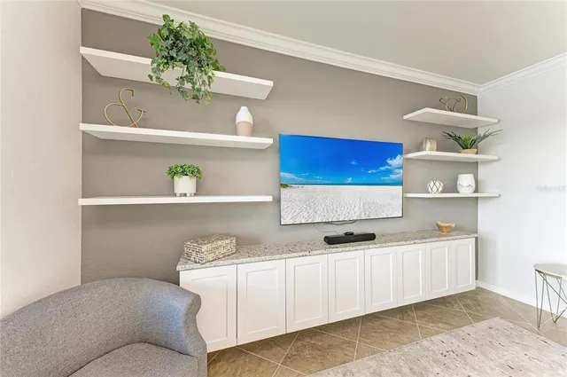 a kitchen with stainless steel appliances granite countertop a sink a stove and a wooden cabinets
