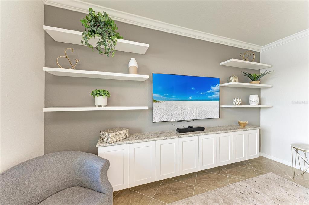 17006 Vardon Terrace, Unit 206 Lakewood Ranch, FL 34211 - Photo 11 of 79 a bedroom with a bed and a chandelier