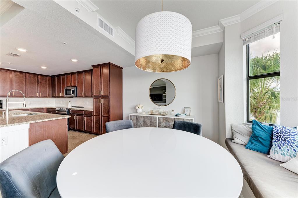 17006 Vardon Terrace, Unit 206 Lakewood Ranch, FL 34211 - Photo 22 of 79 a kitchen with a refrigerator a stove top oven a sink dishwasher and white cabinets next to a window