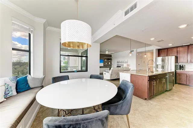 a bathroom with a granite countertop sink mirror vanity and toilet