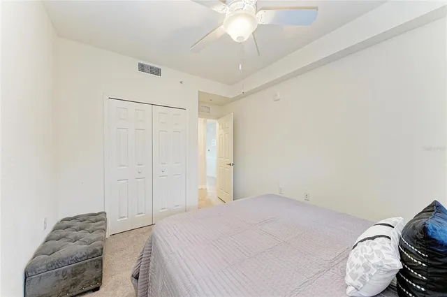 an aerial view of a house with a yard and lake view