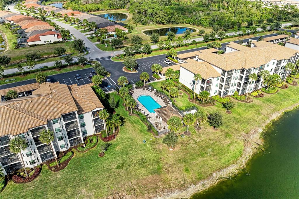 17006 Vardon Terrace, Unit 206 Lakewood Ranch, FL 34211 - Photo 42 of 79 an aerial view of residential houses with outdoor space