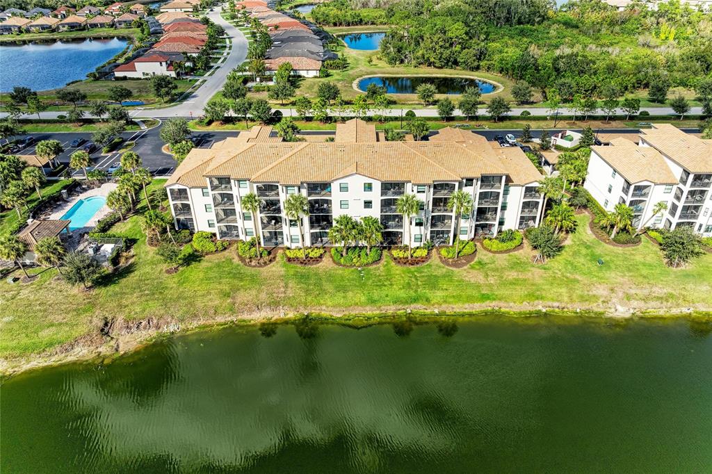 17006 Vardon Terrace, Unit 206 Lakewood Ranch, FL 34211 - Photo 45 of 79 a aerial view of residential houses with outdoor space and swimming pool