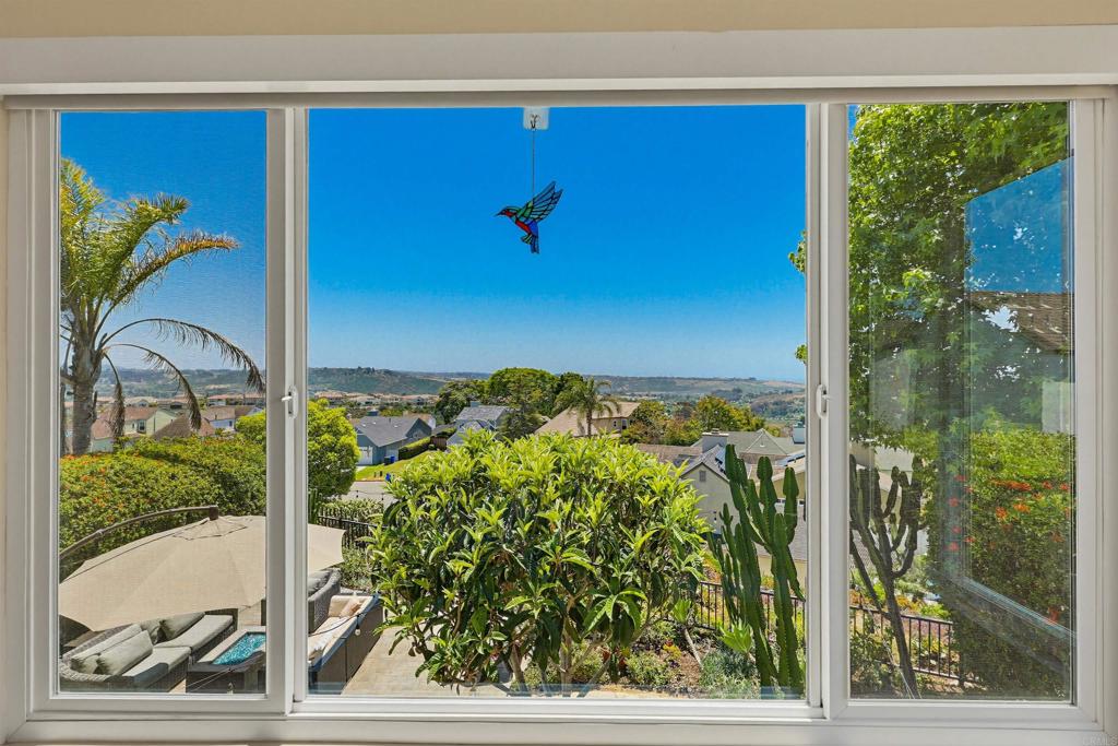 2756 Southampton Road Carlsbad, CA 92010 - Photo 31 of 40 a view of a floor to ceiling window and potted plant