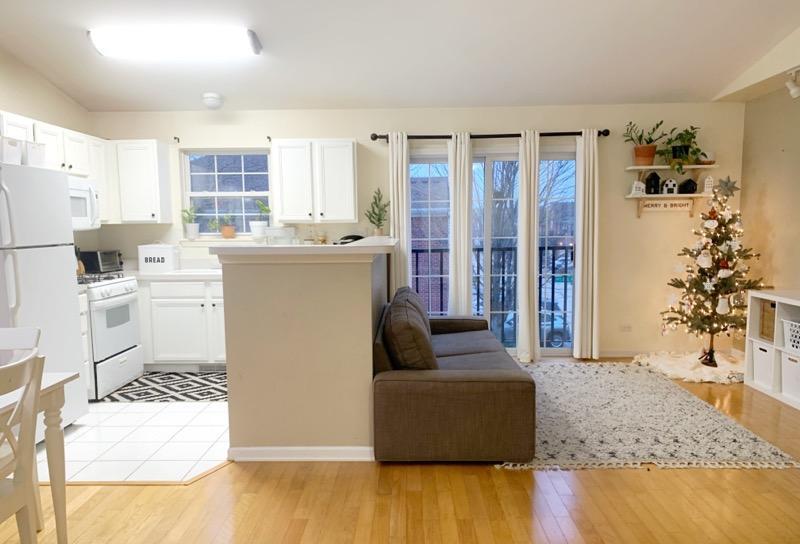 2367 Chelsea Road Northbrook, IL 60062 - Photo 2 of 7 a living room with stainless steel appliances kitchen island granite countertop furniture and a living room