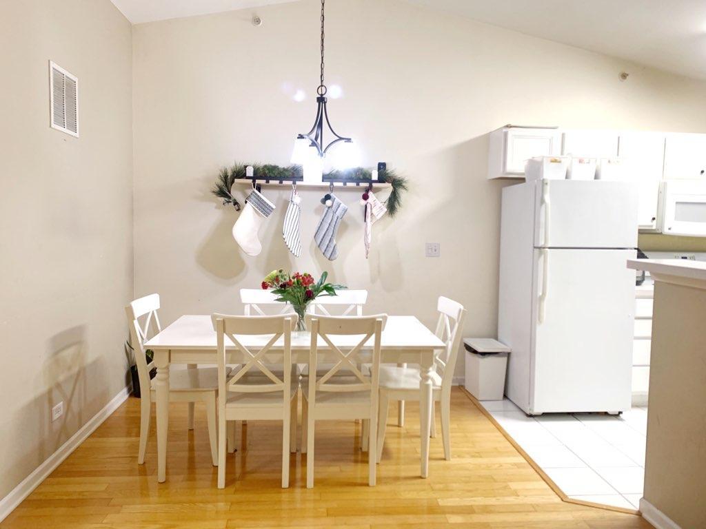 2367 Chelsea Road Northbrook, IL 60062 - Photo 4 of 7 a view of a dining room with furniture and a chandelier