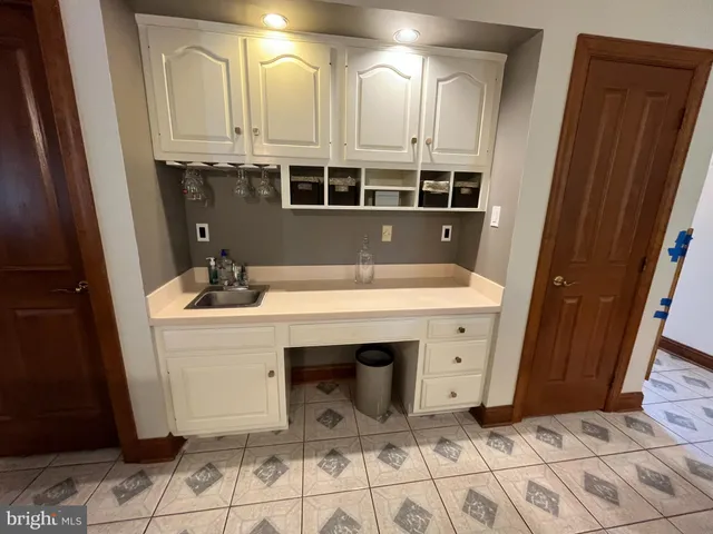a view of a kitchen with electric appliances