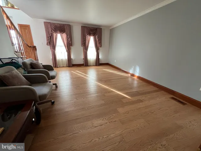 wooden floor in an empty room with windows