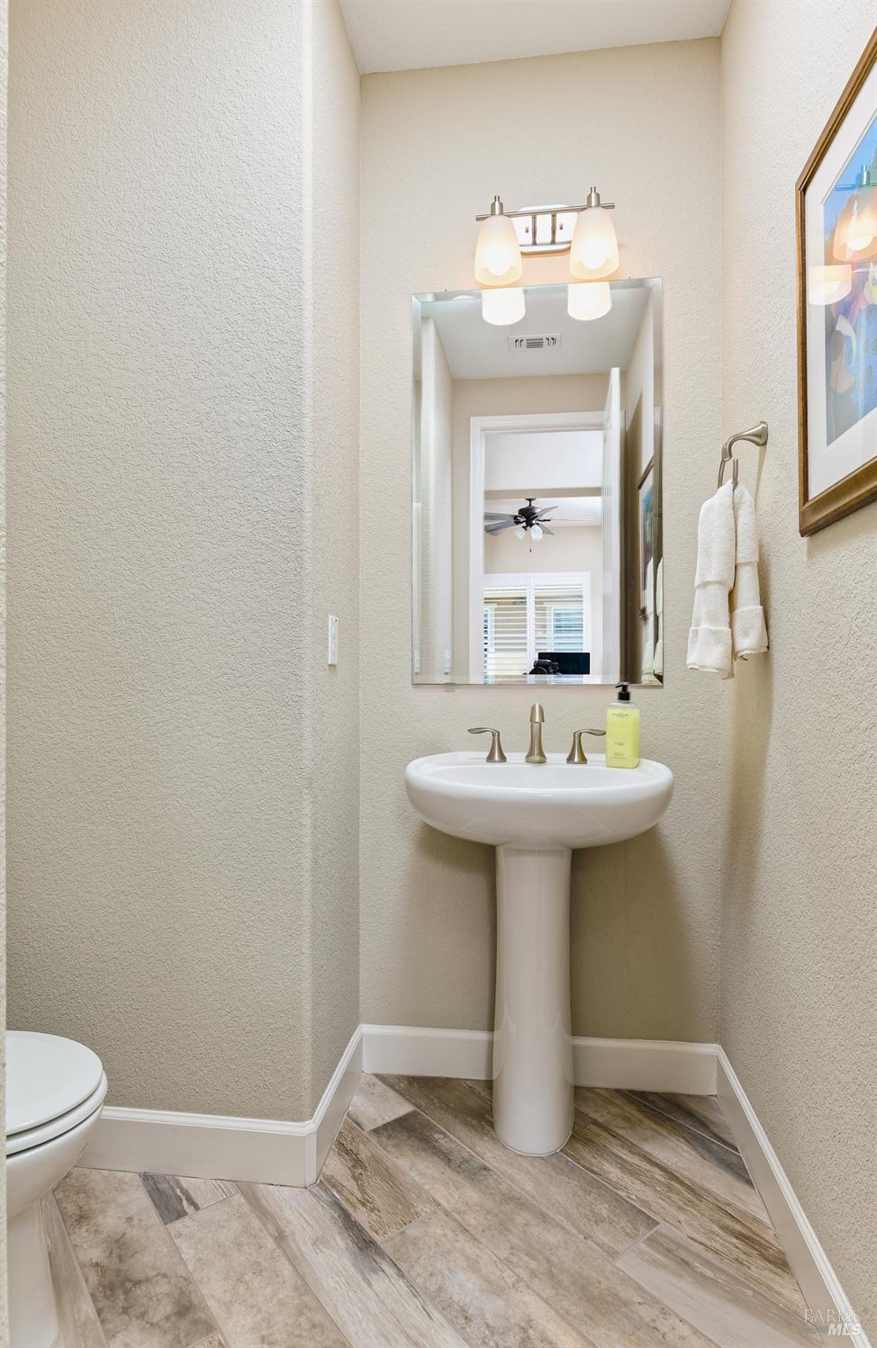 278 Longspur Drive Rio Vista, CA 94571 - Photo 19 of 29 a bathroom with a sink toilet and mirror