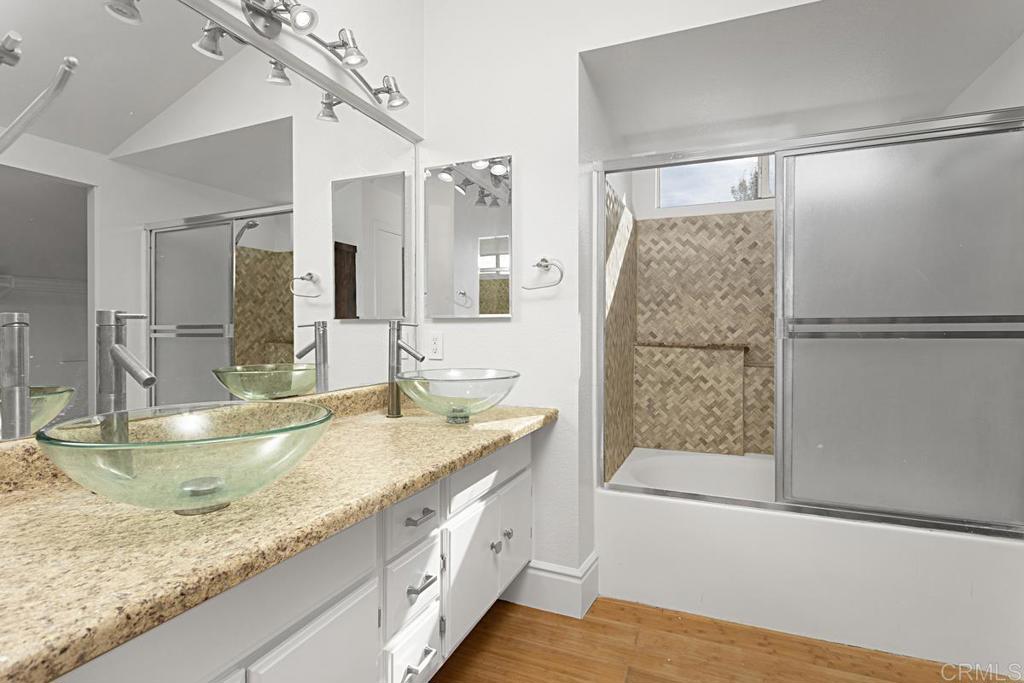 27611 Marian Road Temecula, CA 92591 - Photo 11 of 13 a bathroom with a granite countertop sink and a mirror