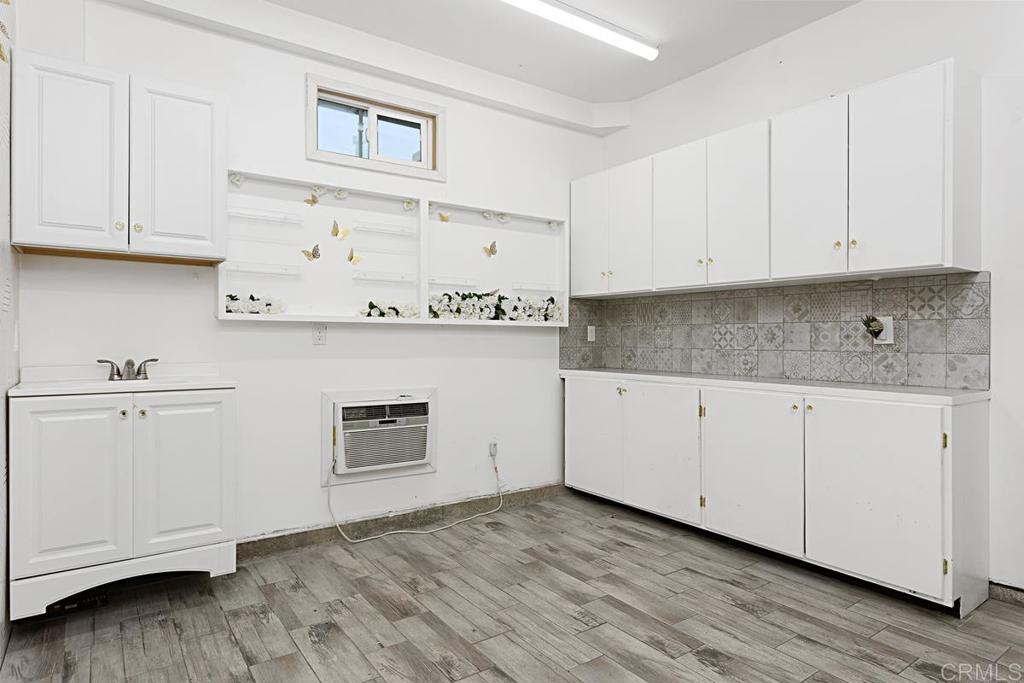 27611 Marian Road Temecula, CA 92591 - Photo 13 of 13 a kitchen with granite countertop white cabinets and white appliances